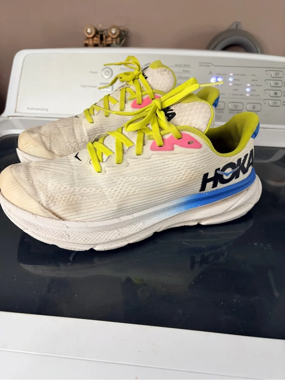 Hoka Yellow and White Running Shoes with Blue Logo Accent
